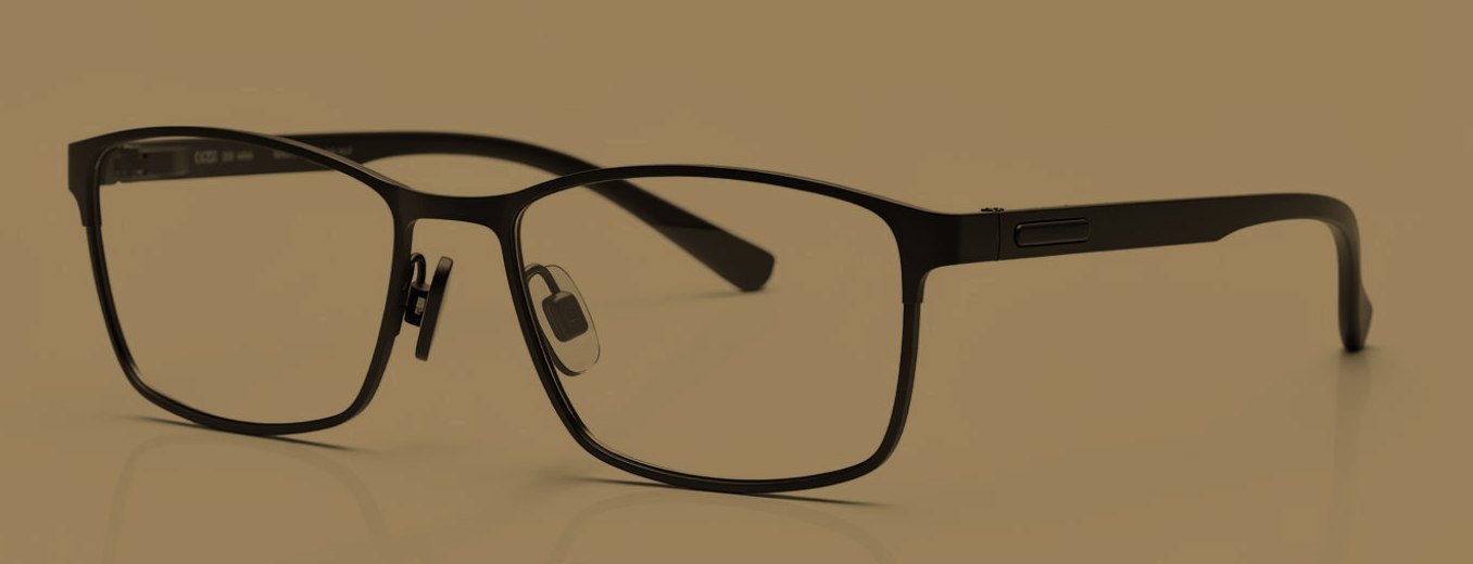 Studio render of the kāānch AI smart glasses, a matte black frame with an integrated temple module.